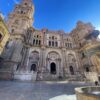 a large building with a fountain in front in Malaga